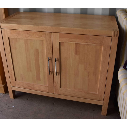 468 - A beech cabinet with two panelled doors, 85cm high by 101cm wide by 41cm deep.