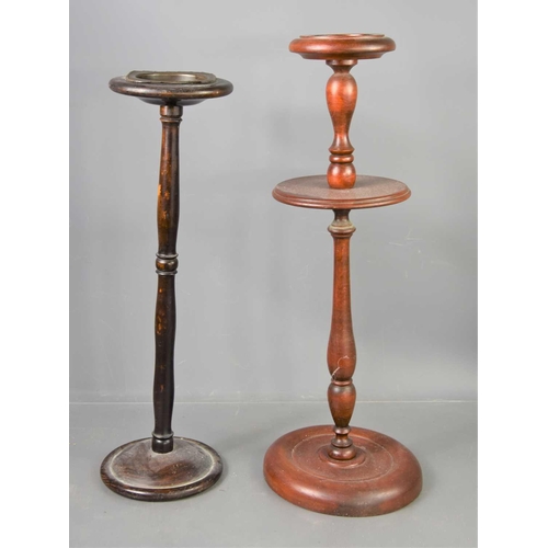 471 - A 1950s oak ashtray stand together with a mahogany example.