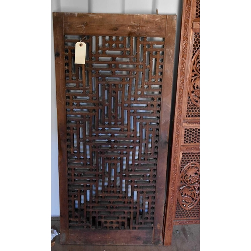 489 - A bi-fold Indonesian hardwood carved screen, together with a carved panel, the screen measures 182cm... 