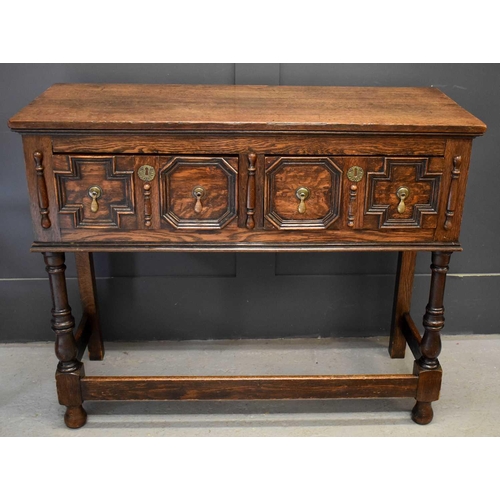 490 - A 17th century style oak sideboard, with two short geometric moulded drawers, raised on turned legs ... 