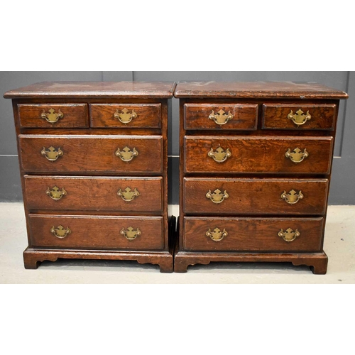 500 - A pair of 18th century style oak chests / bedside cabinets, of small proportions, with two short ove... 