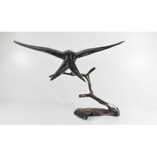 180 - A steel sculpture of a swift landing on a branch, unsigned, 39cm high.