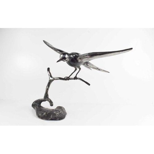 180 - A steel sculpture of a swift landing on a branch, unsigned, 39cm high.