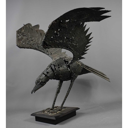 188 - A metalwork sculpture, in the form of a crow with outspread wings, 60cm high.