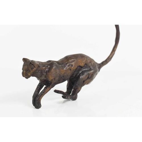 193 - A 20th century bronze sculpture of a cat, 13cm long, unsigned.