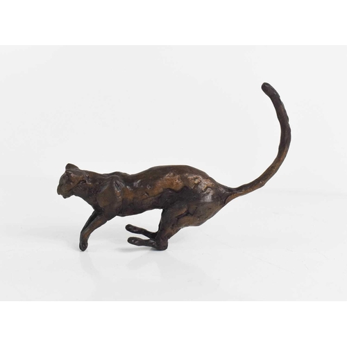 193 - A 20th century bronze sculpture of a cat, 13cm long, unsigned.