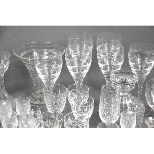 244 - A large group of crystal and glassware of various shapes and sizes to include decanters.