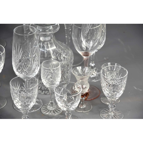 244 - A large group of crystal and glassware of various shapes and sizes to include decanters.