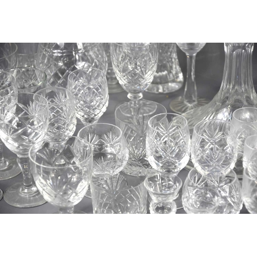 244 - A large group of crystal and glassware of various shapes and sizes to include decanters.