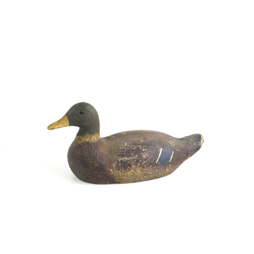 296 - A 19th century wooden decoy duck with signs of residual paint, 19cm high.