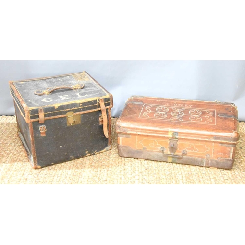 298 - A large antique leather travelling case, 34cm by 46cm by 43cm, together with a 19th century metal cl... 