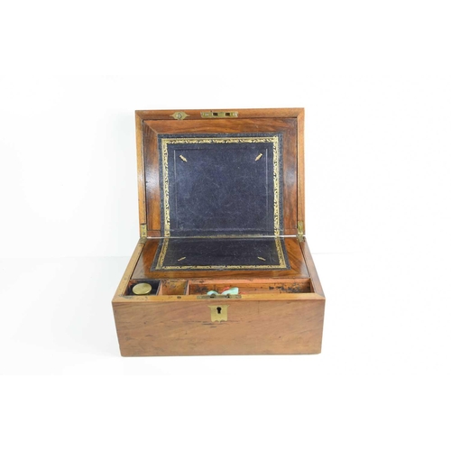 322 - A 19th century writing slope, complete with gilt tooled, black leather slip and brass topped inkwell... 