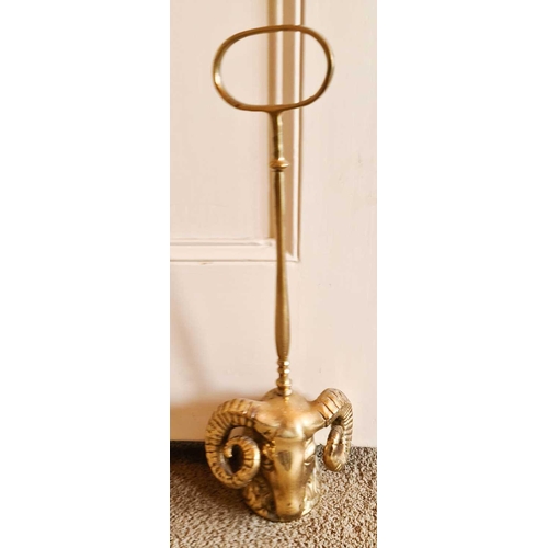 323 - An antique brass door stop, in the form of a rams head, with hoop handle, 49cm high.