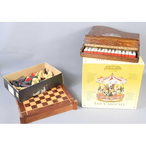 385 - A vintage wooden cased toy Grand Baby piano together with Carlton chess pieces and a Gold Label Chri... 