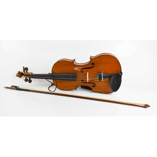 425 - An antique Violin and bow, maple with two piece back.