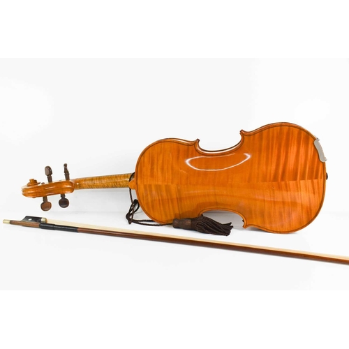 425 - An antique Violin and bow, maple with two piece back.