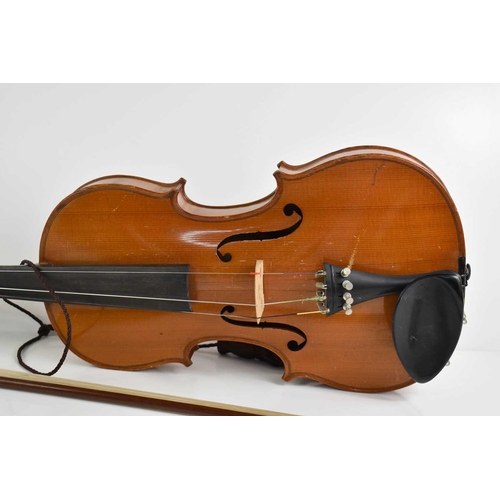 425 - An antique Violin and bow, maple with two piece back.