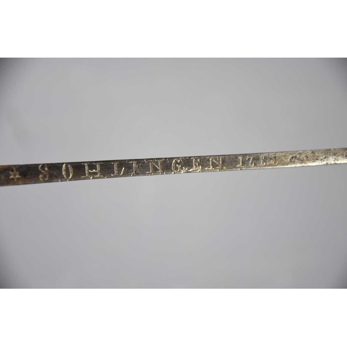 498 - A French late 18th century sword, of curved form, engraved to the blade with motto 'Ne moi tirez pas... 