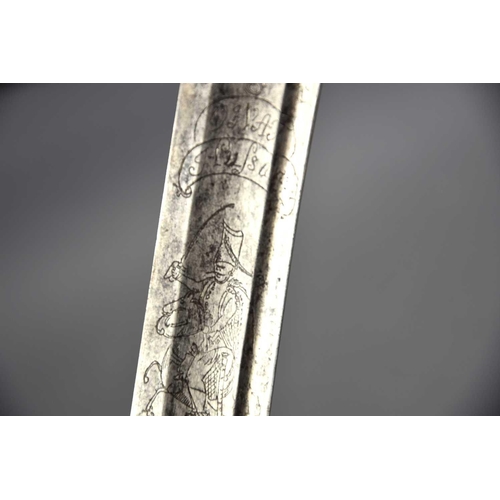 498 - A French late 18th century sword, of curved form, engraved to the blade with motto 'Ne moi tirez pas... 