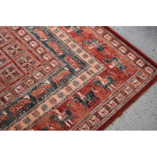 512 - A John Lewis red ground wool rug, 300cm by 200cm.