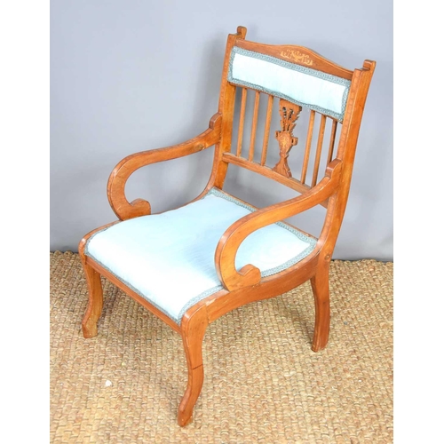 518 - An Edwardian mahogany and inlaid bedroom chair covered in a blue woven material with closed back and... 