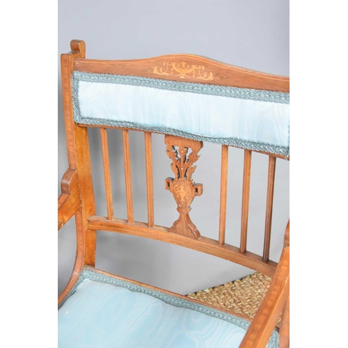 518 - An Edwardian mahogany and inlaid bedroom chair covered in a blue woven material with closed back and... 