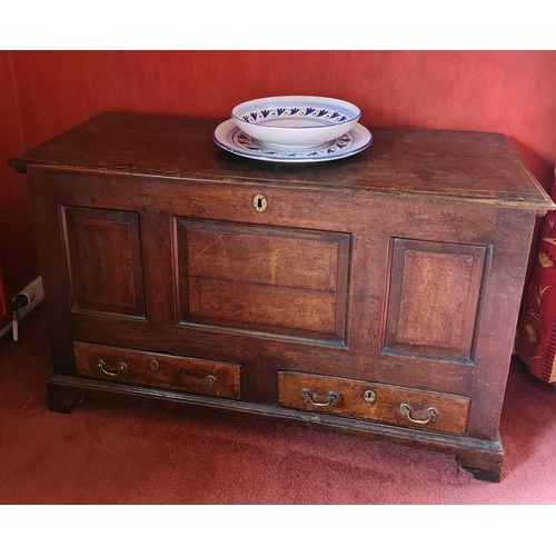 530 - An early 18th century oak mule chest, the rectangular top with moulded edge, triple panel front, abo... 