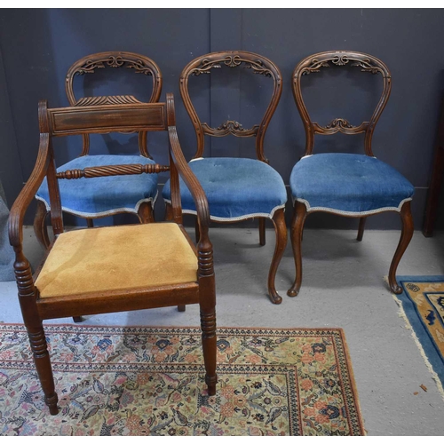 538 - A set of three 19th century dining chairs with carved balloon backs and blue velvet upholstered seat... 