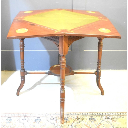 554 - A 19th century mahogany games table, the top opening with four triangular flaps, 73cm high by 54cm b... 