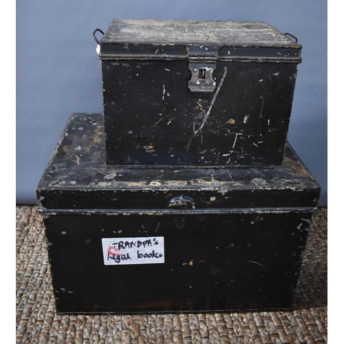 560 - Two antique tin strong boxes, both painted black and having twin handles, 25cm high.