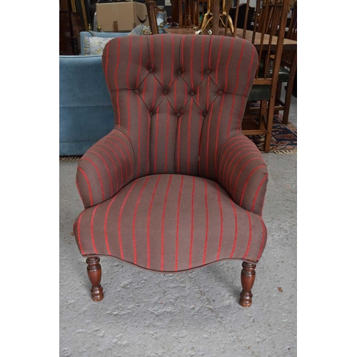 571 - A button back armchair, in newly upholstered striped fabric, raised on mahogany turned legs.