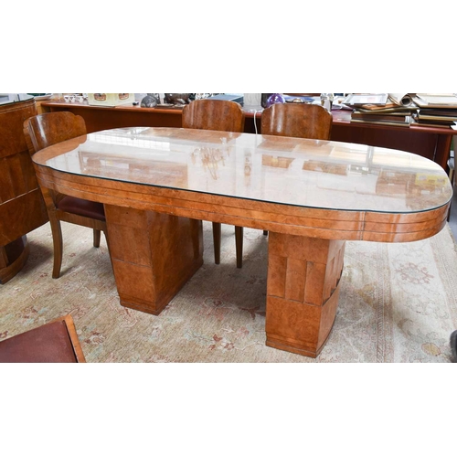 614 - Manner of Harry and Lou Epstein: An Art Deco maple dining table with rounded rectangular top, raised... 