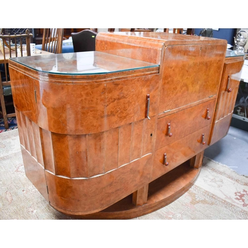 615 - Manner of Harry and Lou Epstein: An Art Deco maple drinks cabinet with the centre opening out to rev... 