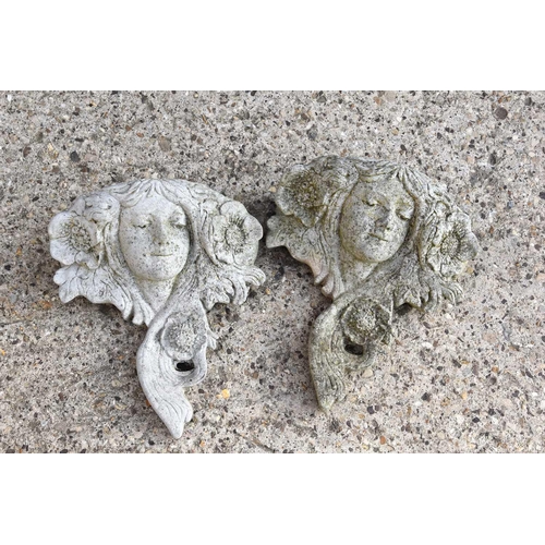 622 - A pair of reconstituted stone wall planters in the form of a classical lady, 36cm by 33cm.