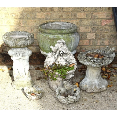 625 - A reconstituted stone urn shaped planter, a cherub form bird bath and other ornaments.