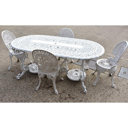 635 - A Victorian-style painted aluminium garden table and set of four chairs.