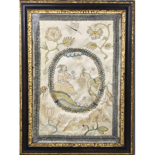 98 - A late Georgian silk embroidered panel depicting a girl holding a flower with dog at her feet in a r... 