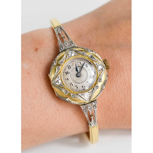 11 - An 18ct gold and diamond ladies cocktail watch, with Arabic dial,the circular dial inset with diamon... 