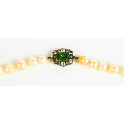 12 - A Georgian pearl necklace, with a gold (tested as 14ct) clasp set with a central emerald bordered by... 