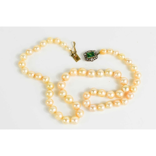 12 - A Georgian pearl necklace, with a gold (tested as 14ct) clasp set with a central emerald bordered by... 