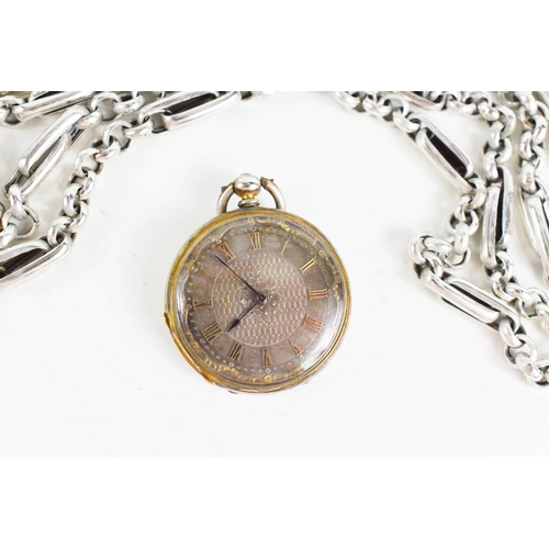 128 - A 19th century silver plated pocket watch with silvered dial and engraved decoration to the case, to... 