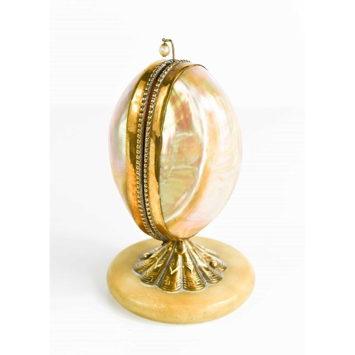 132 - An early 20th century brass and mother of pearl shell watch stand.