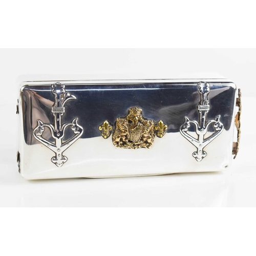 149 - A large silver cigarette box, London 1896, with embossed armorial decoration in brass to the top and... 