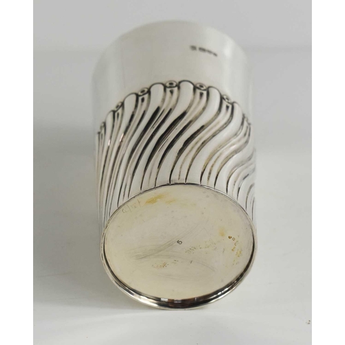 150 - A silver beaker, Chester 1903, decorated with fluted and reeded decoration to the mid section, resid... 