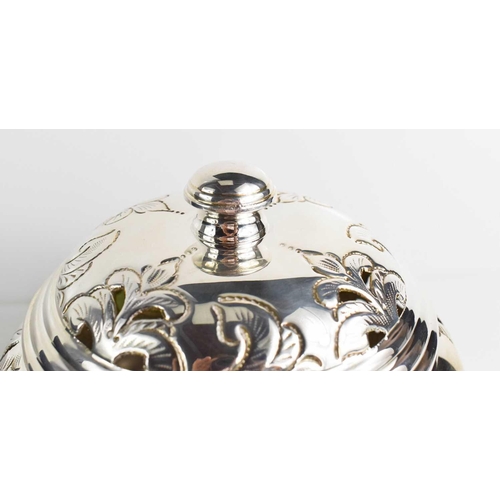 159 - A silver 800 grade pot pouri and cover, the body and lid embossed and engraved with scroll decoratio... 