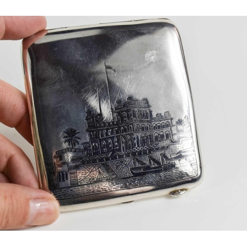 176 - A niello and white metal cigarette case, possibly Egyptian silver, decorated with river scenes, with... 