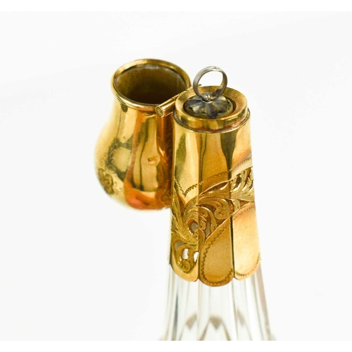 19 - A fine cut glass and gold plated scent bottle, the bulbous cover opens to reveal a silver mounted co... 