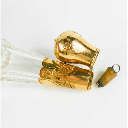 19 - A fine cut glass and gold plated scent bottle, the bulbous cover opens to reveal a silver mounted co... 