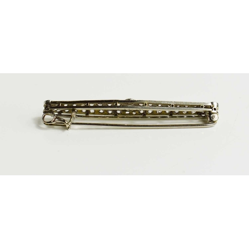 203 - An Art Deco 18ct white gold, platinum, and diamond bar brooch, set with a central diamond approximat... 