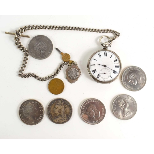 208 - A silver pocket watch with a silver Albert chain and fob together with a group of crowns to include ... 